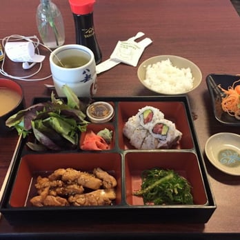 Sakura Sushi & Kitchen - A chicken teriyaki Bento box with tea and salmon sashimi. - Sushi Bars Near Me - Williston, Vermont Sakura Sushi & Kitchen - A chicken teriyaki Bento box with tea and salmon sashimi. - Sushi Bars Near Me - Williston, Vermont