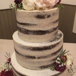 Our Beautiful "Naked" style Chocolate cake, with buttercream/chocolate ganache. Our guests were so impressed, a perfect addition to our day! Our Beautiful "Naked" style Chocolate cake, with buttercream/chocolate ganache. Our guests were so impressed, a perfect addition to our day!