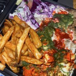Mixed combo platter with chicken and lamb over rice