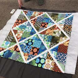 Finished her window pane quilt