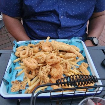 District Seafood - Seafood platter with fries. A few shrimp and calamari atop a bed of fries - Seafood Near Me - Savannah, Georgia District Seafood - Seafood platter with fries. A few shrimp and calamari atop a bed of fries - Seafood Near Me - Savannah, Georgia