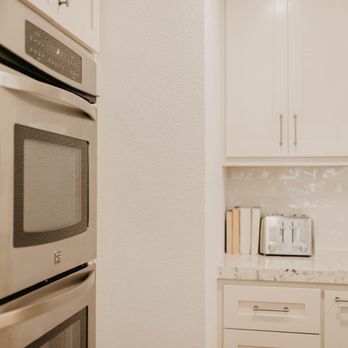 Apex Construction Innovations - kitchen with white cabinets and stainless steel appliances - General Contractors Near Me Apex Construction Innovations - kitchen with white cabinets and stainless steel appliances - General Contractors Near Me