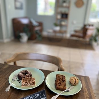 Alms + Fare - two plates of cake on a table - Bakeries Near Me - St. Augustine, Florida