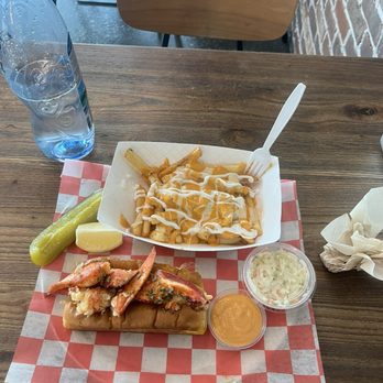 Steami's Lobster - Maine lobster roll (served warm) with crab fries - Seafood Near Me - Duluth, Georgia Steami's Lobster - Maine lobster roll (served warm) with crab fries - Seafood Near Me - Duluth, Georgia