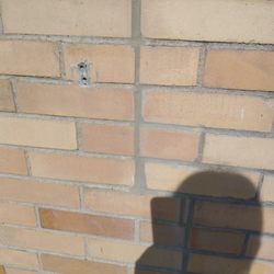 Escajeda Masonry & Chimney - They did the repair correctly but they left the crumbling brick above.