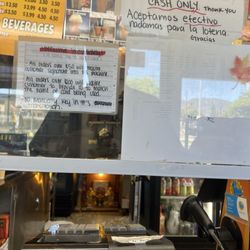Sam's Donuts & Coffee - The signs posted she referred to to explain the charge .