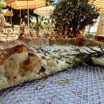 Truly Pizza - Potato Bianca -- round white pizza with creamy sauce, potatoes, cheeses, garlic + rosemary - Pizza Near Me - Laguna Beach, California