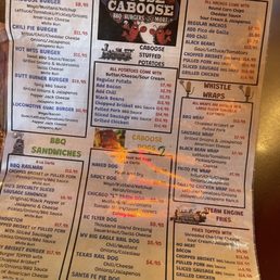 The menu includes barbecue sandwiches, burgers, and smoked meats, with options like brisket, pulled pork, and hot dogs, along with sides and drinks.