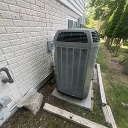 Enova Heating & Air Conditioning - Old heat pump.