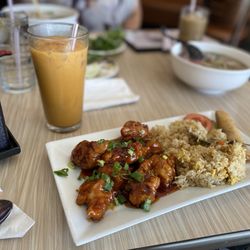 Saigon USA Pho & Grill - Orange Chicken that comes with eggroll and fried rice. And Thai Tea (does not come with fried rice)