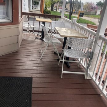 Den Bubble Tea - a table and chairs on a porch - Bubble Tea Near Me - harrisburg, Pennsylvania
