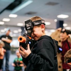 Tactical Urban Combat - Future sharpshooter in action! Tactical gear on, game face ready - join the Laser Tag excitement at Tactical Urban Combat!