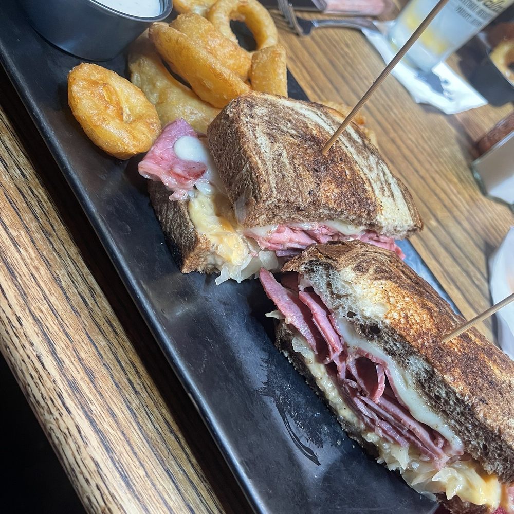 The Palace - Wrangler's Reuben with onion rings and ranch dressing - Bars Near Me - Prescott, Arizona The Palace - Wrangler's Reuben with onion rings and ranch dressing - Bars Near Me - Prescott, Arizona
