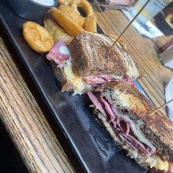 The Palace - Wrangler's Reuben with onion rings and ranch dressing - Bars Near Me - Prescott, Arizona