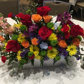 Rogers Flower Shop - One of the silver, low arrangements for the dining tables - Florists Near Me - Ontario, California Rogers Flower Shop - One of the silver, low arrangements for the dining tables - Florists Near Me - Ontario, California