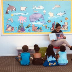Searchlight Ministries Preschool - Students enjoying being read to