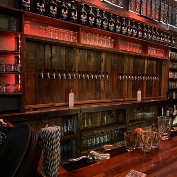 Alulu Brewpub - a bar with a wooden bar top - New American Near Me - Chicago, Illinois Alulu Brewpub - a bar with a wooden bar top - New American Near Me - Chicago, Illinois
