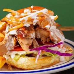 Pipilinka - Pollo a la Brasa Sandwich, served with our homemade sauce and fries.