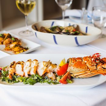 Remissis Restaurant - a plate of grilled lobsters - Seafood Near Me - Miami, Florida Remissis Restaurant - a plate of grilled lobsters - Seafood Near Me - Miami, Florida