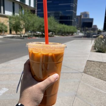 Thai Basil - a hand holding a cup of iced coffee - Thai Near Me - Phoenix, Arizona Thai Basil - a hand holding a cup of iced coffee - Thai Near Me - Phoenix, Arizona