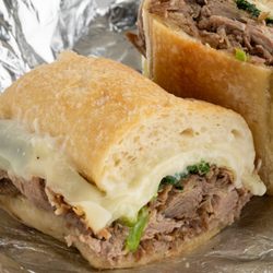 JC's Central Deli - Italian roasted pork with broccoli rabe, provolone cheese & garlic mayo on a toasted Ciabatta.