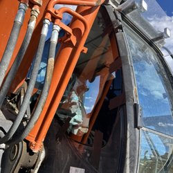 Midwest Autoglass - Replacement side Glass on excavator