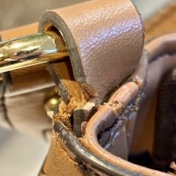 Marelli Brothers - I gave them my purse with a ripped strap loop plus a new loop to replace it with. They sewed the new loop in and somehow RIPPED IT, TOO!!!