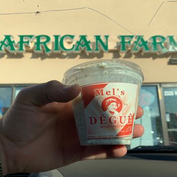 African Farms - a hand holding a cup of ice cream - Specialty Food Near Me - Omaha, Nebraska African Farms - a hand holding a cup of ice cream - Specialty Food Near Me - Omaha, Nebraska