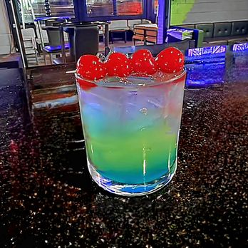 Westend Tavern - a colorful drink with cherries in it - Bars Near Me - Charlotte, North Carolina Westend Tavern - a colorful drink with cherries in it - Bars Near Me - Charlotte, North Carolina