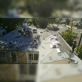 Delcid Roofing - Half of a roof done with 30 year shingles being installed. - Roofing Near Me - Los Angeles, California