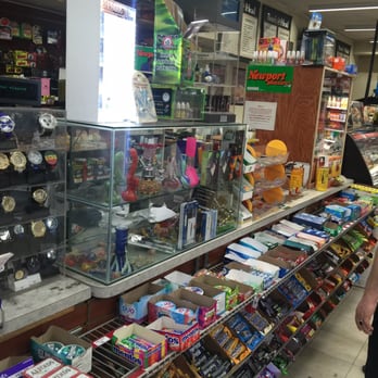Oakwood Superette - a man in a store - Grocery Near Me - Shirley, New York