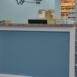 Eyal D. Waldman, DMD - Front desk from large empty waiting room