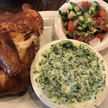 Cowboy Chicken - Half chicken, tomato cucumber salad with cream spinach - American Near Me - Baton Rouge, Louisiana