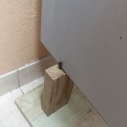 I think there is supposed to be something a little sturdier holding this bathroom panel in place.