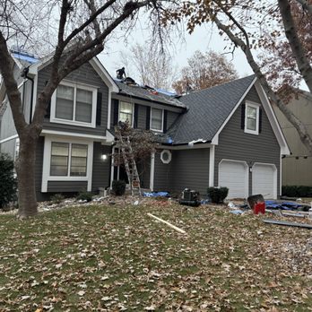 Johnson County Guttering and Roofing - Near completion of roof replacement in Olathe with new shingles and gutter system installed to improve drainage and protect the home. - Gutter Services Near Me - Olathe, Kansas