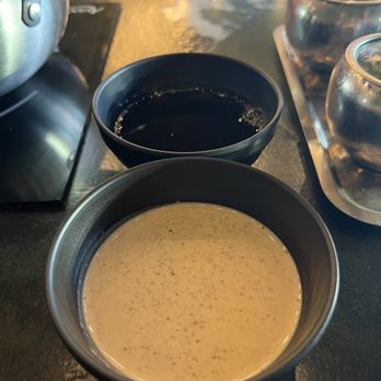 212 Shabu - Ponzu (above) and goma (below) - Japanese Near Me - Tempe, Arizona 212 Shabu - Ponzu (above) and goma (below) - Japanese Near Me - Tempe, Arizona
