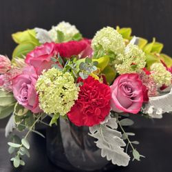 Basic Bitch Blooms - Luscious Garden Bowl - featuring green cymbidium orchids, roses, carnations and verbena.

Available in a variety of color combinations.