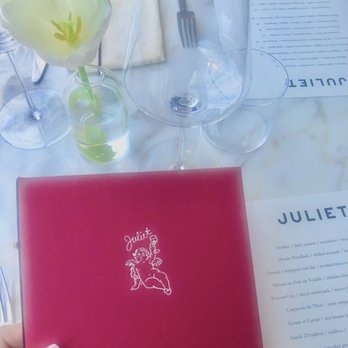 Juliet - cherub Cupid on the menu cover - French Near Me - Culver City, California