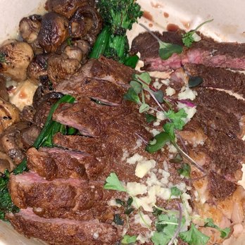 Primal Cuts - 12 oz. Ribeye Cut with Roasted Broccolini and Roasted Button Mushrooms - Steakhouses Near Me - Stanton, California Primal Cuts - 12 oz. Ribeye Cut with Roasted Broccolini and Roasted Button Mushrooms - Steakhouses Near Me - Stanton, California