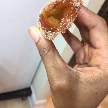 Pizza Hut - a hand holding a sugared donut - Pizza Near Me - Jacksonville, North Carolina Pizza Hut - a hand holding a sugared donut - Pizza Near Me - Jacksonville, North Carolina
