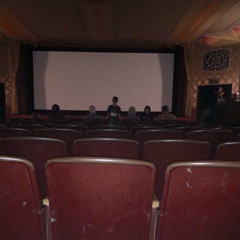 Strand Theater - The seats are perfectly aligned. As in, not staggered. Note the happy folks sitting in the first row. - Performing Arts Near Me - Schroon Lake, New York Strand Theater - The seats are perfectly aligned. As in, not staggered. Note the happy folks sitting in the first row. - Performing Arts Near Me - Schroon Lake, New York