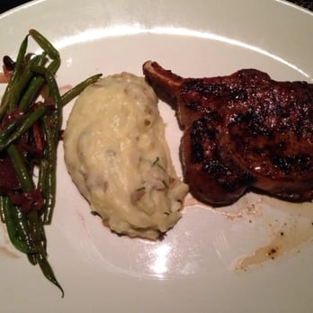 J Gilbert's - 14 oz bone in pork chip with yukon mash potatoes and green beans with pecans - Steakhouses Near Me - McLean, Virginia