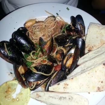 Campania - Spaghetti with mussels and tomato sauce has tons of mussels (more than pictured), but the sauce doesn't have any seafood flavor. - Pizza Near Me - Alpharetta, Georgia Campania - Spaghetti with mussels and tomato sauce has tons of mussels (more than pictured), but the sauce doesn't have any seafood flavor. - Pizza Near Me - Alpharetta, Georgia