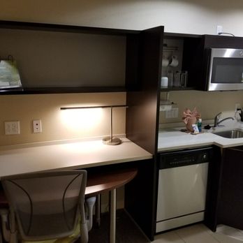 Home2 Suites by Hilton Houston/Katy - Desk area with table, as well as kitchenette. - Hotels Near Me - Katy, Texas
