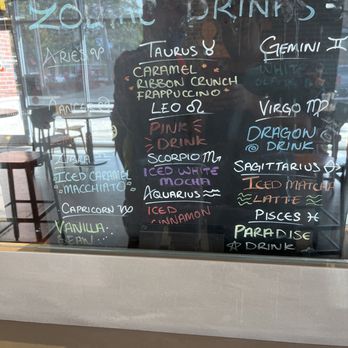 Starbucks - a menu on the glass of a coffee shop - Coffee & Tea Near Me - Chicago, Illinois Starbucks - a menu on the glass of a coffee shop - Coffee & Tea Near Me - Chicago, Illinois