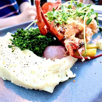 Blue Mussel Cafe - Shelled half lobster with seasoned mashed potatoes and pickled onions - Seafood Near Me - Rustico, Prince Edward Island