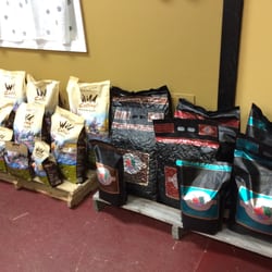 All Things Pawssible - Some of the dog food brands offered in their shop by the welcome desk