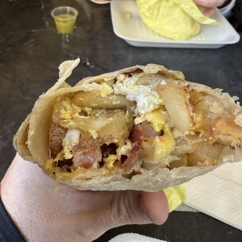 Los Aribertos American Fork - Mixed Breakfast burrito with egg, ham, bacon and hash-browns. - Mexican Near Me - American Fork, Utah Los Aribertos American Fork - Mixed Breakfast burrito with egg, ham, bacon and hash-browns. - Mexican Near Me - American Fork, Utah