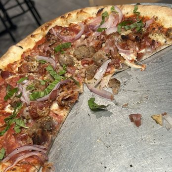 V Pizza - Carnivora pizza... sorry it's not complete, but we couldn't wait to dig in! - Pizza Near Me - Orlando, Florida V Pizza - Carnivora pizza... sorry it's not complete, but we couldn't wait to dig in! - Pizza Near Me - Orlando, Florida