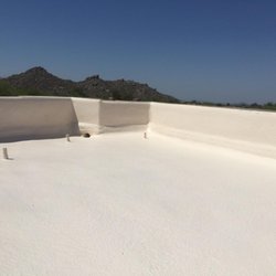 Durafoam Roofing - New foam roof with foam up and over cracked parapet walls